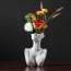 Vase en céramique avec visage abstrait de face